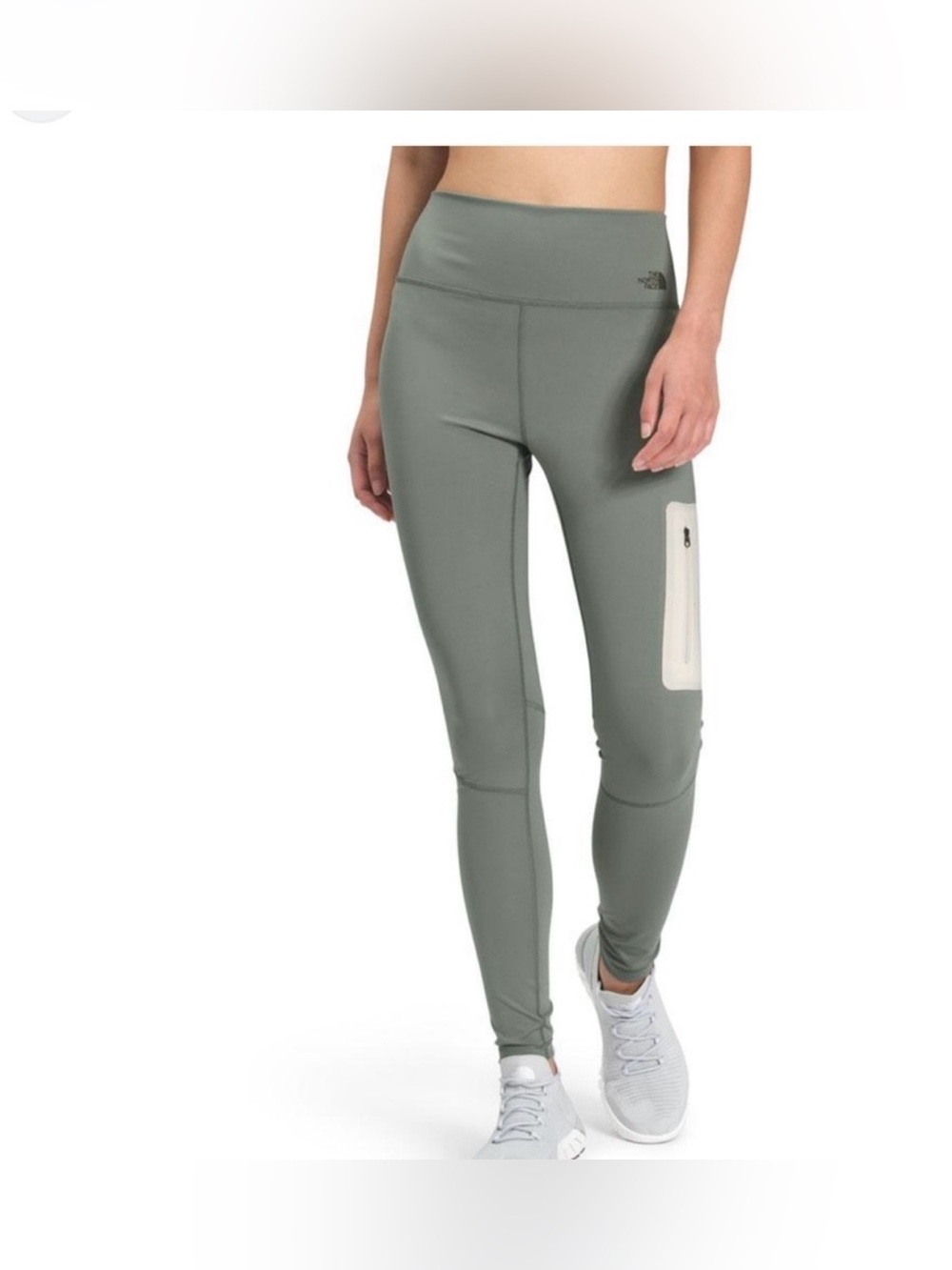 Worn once. The North Face Women's  High-Rise Tights in green with pockets.
